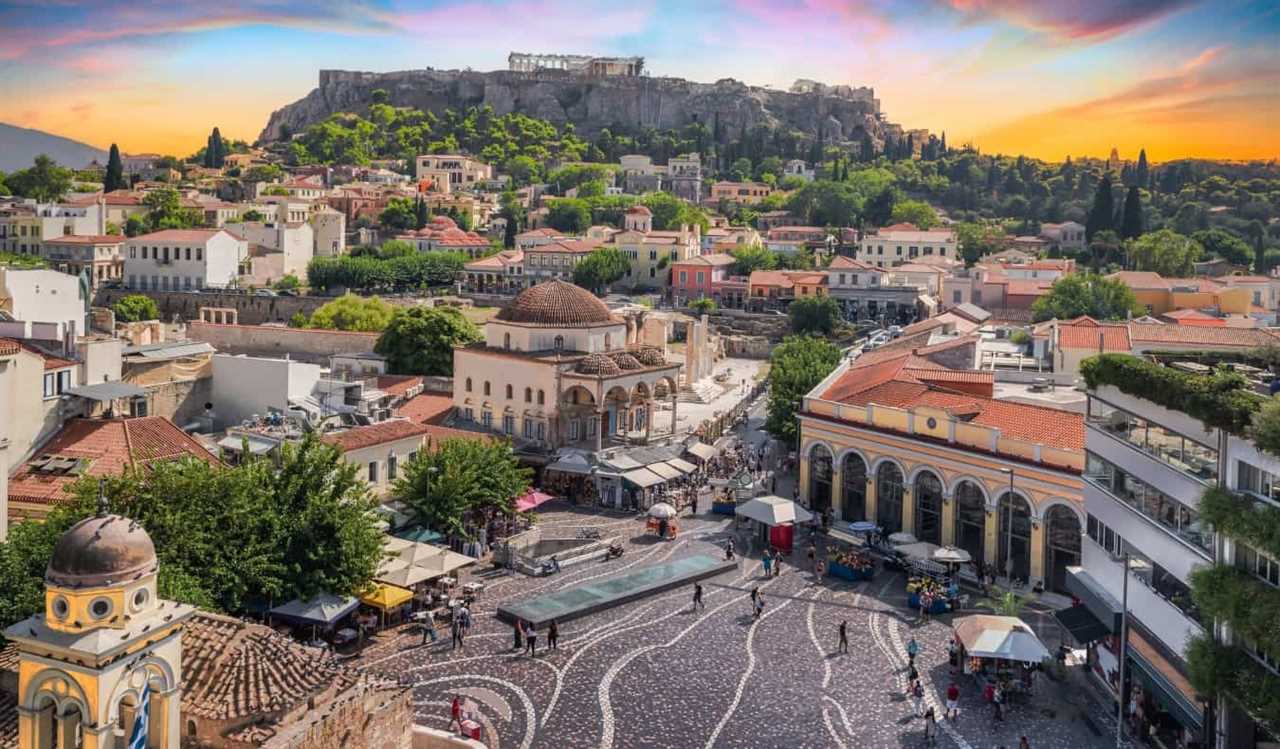 The old town of Athens at sunset with the Acropolis in the distance