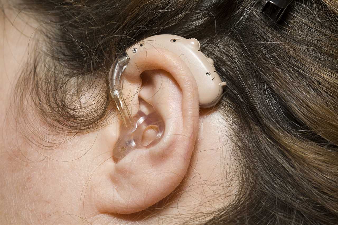 Close up of woman wearing digital hearing aid