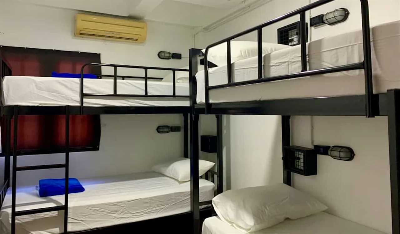 Simple bunk beds in a dorm at the Revolution party hostel in Chiang Mai, Thailand