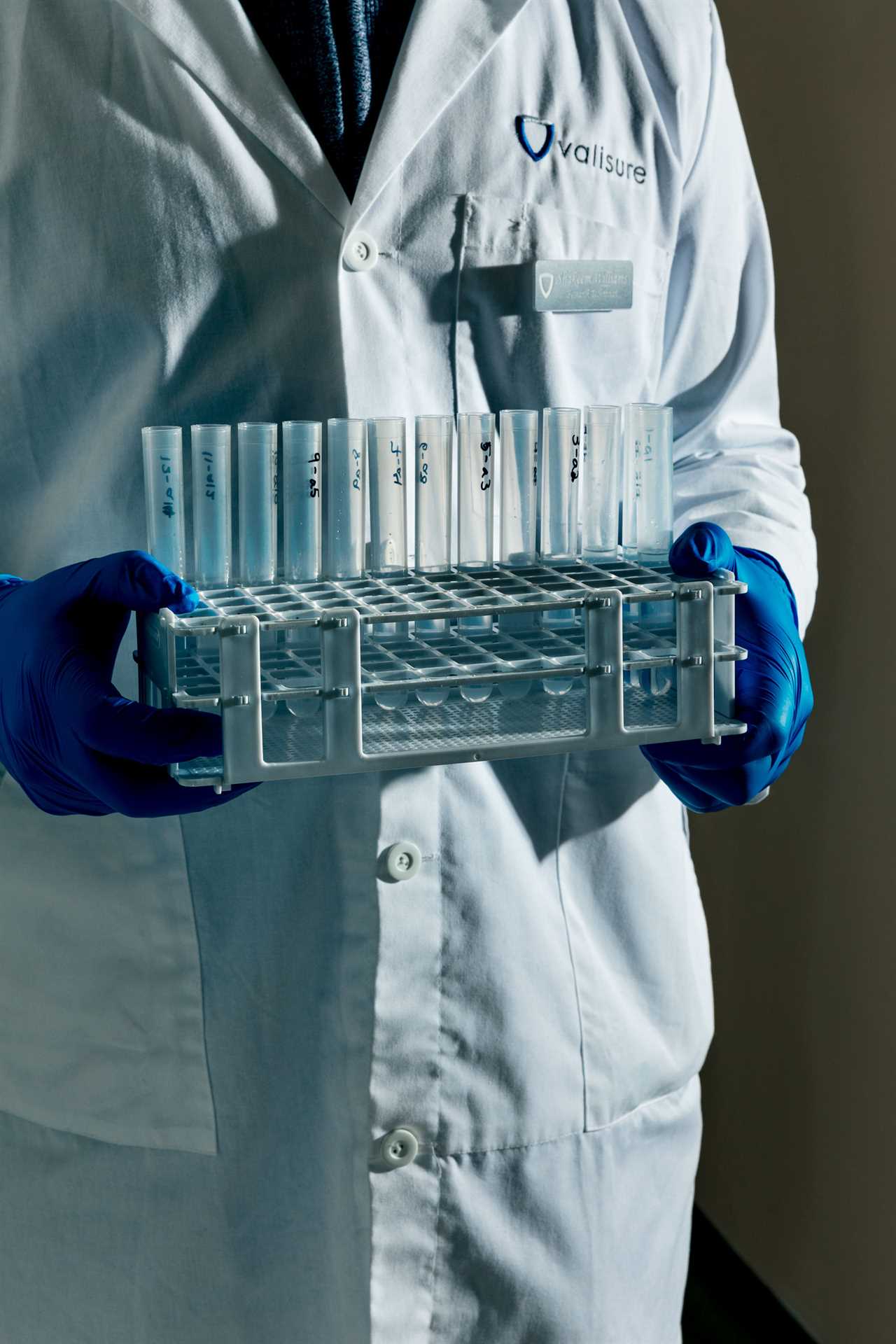 A Valisure employee carries lab samples.