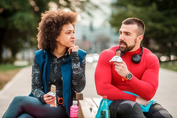 Man And Woman Eat Snack Together | Calories to Maintain Weight