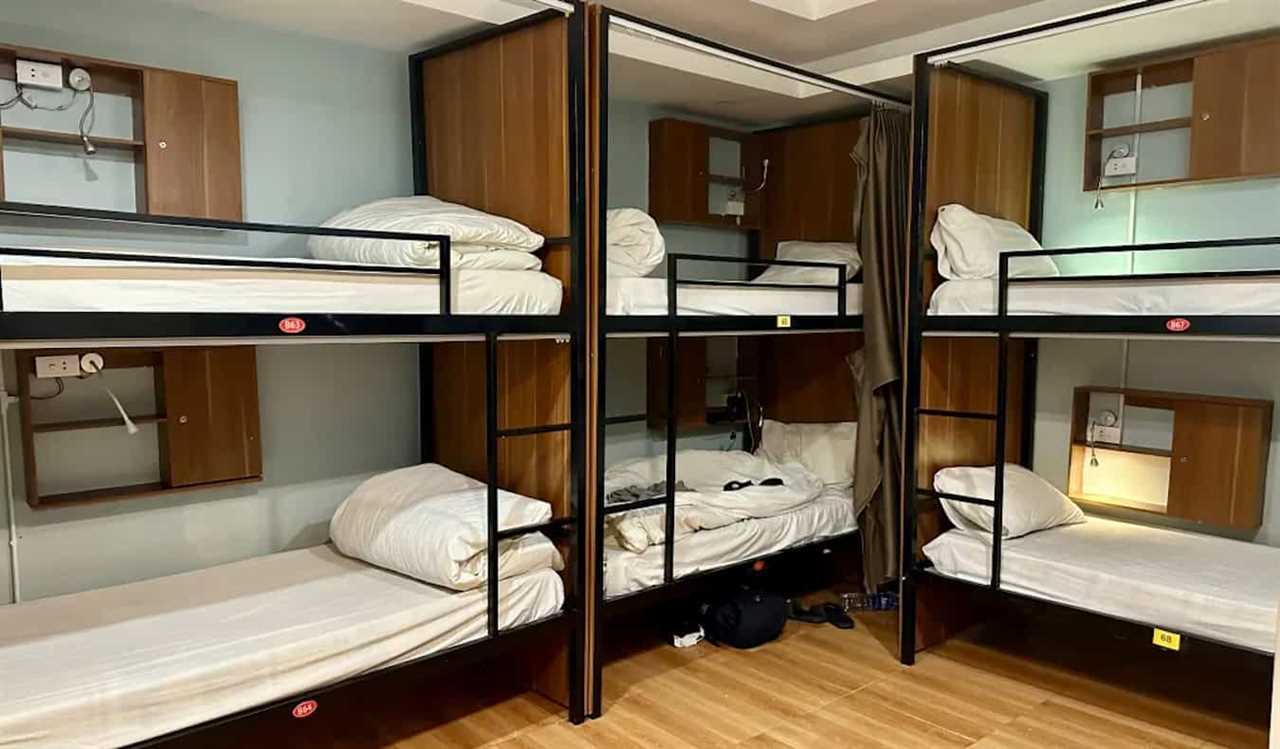 A handful of old bunk beds in a dorm room at Hanoi Central Backpackers hostel in Hanoi, Vietnam