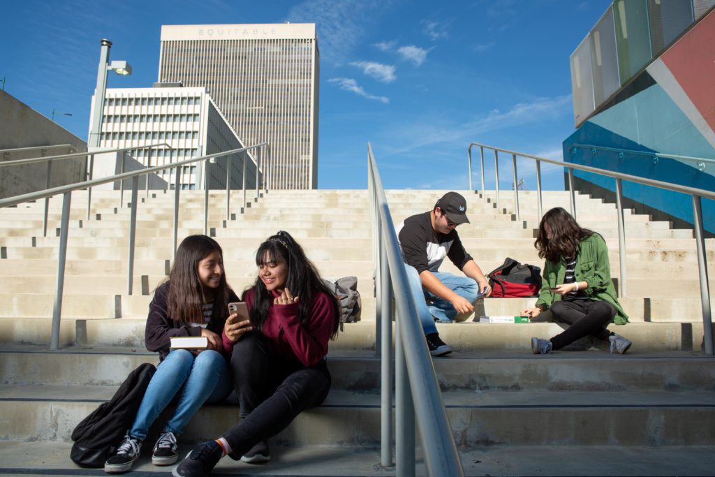 High school students sitting on stairs