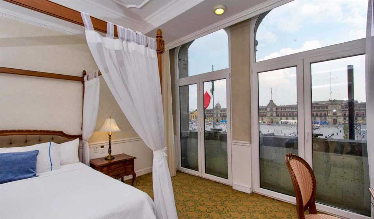 A spacious hotel room at the Gran Hotel in Mexico City with a nice view looking out over the city