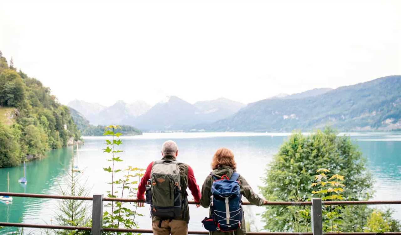 An older couple enjoying the view as they travel the world together