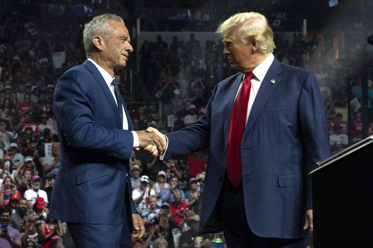 Robert F. Kennedy Jr. and President-elect Donald Trump shake hands during a campaign rally at Desert Diamond Arena Glendale, Ariz. on Aug. 23. 