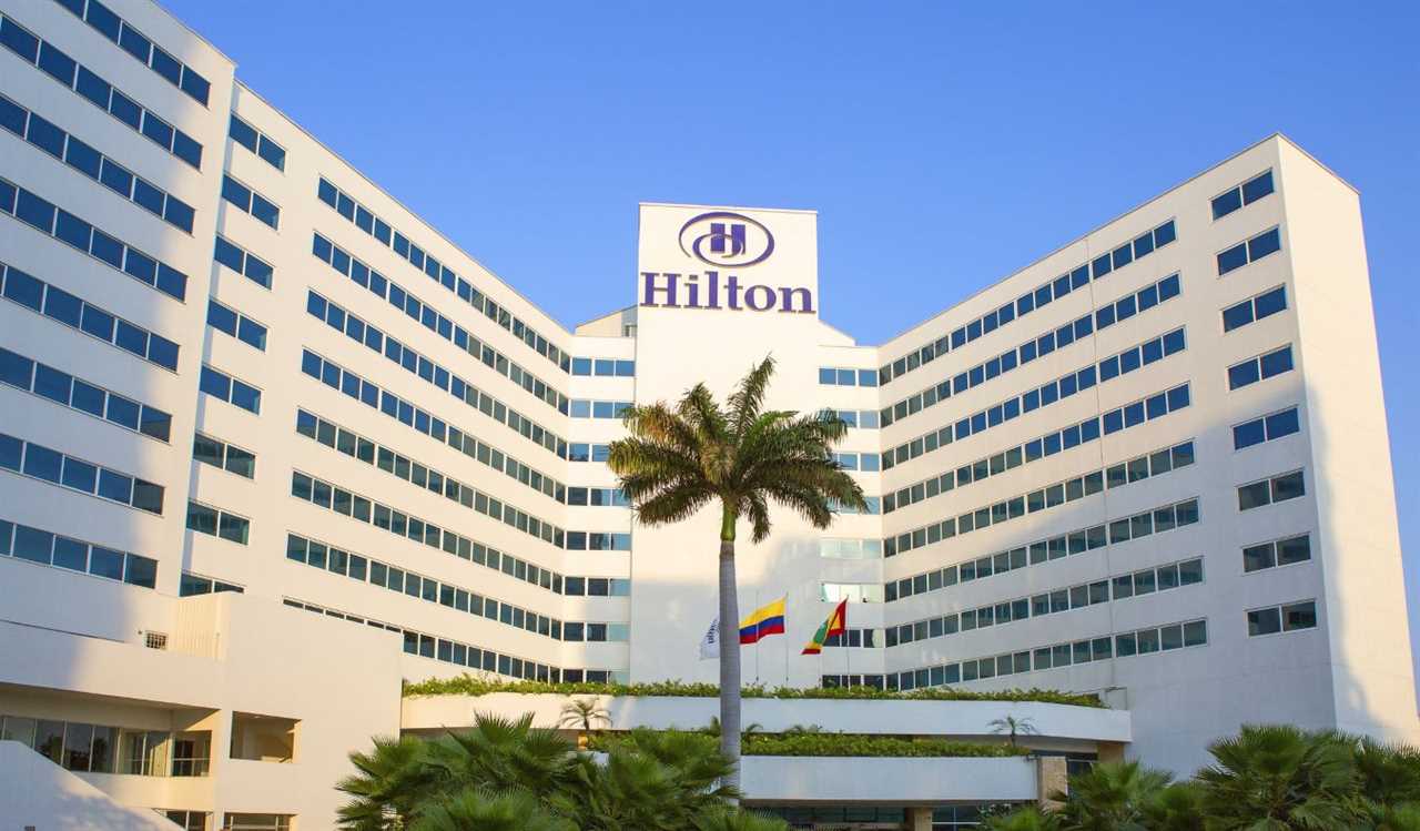 A Hilton hotel in Cartagena, Colombia, with a large palm tree in front