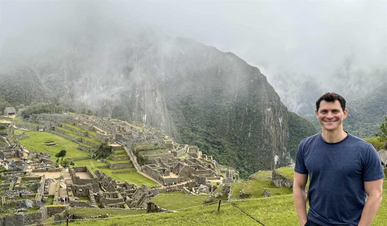 Nomadic Matt posing for a photo near Machu Picchu in Peru