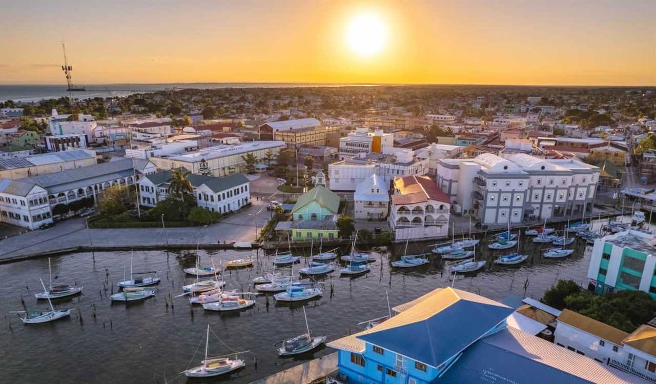 Aerial photo of the river mouth area filled with boats near downtown Belize City