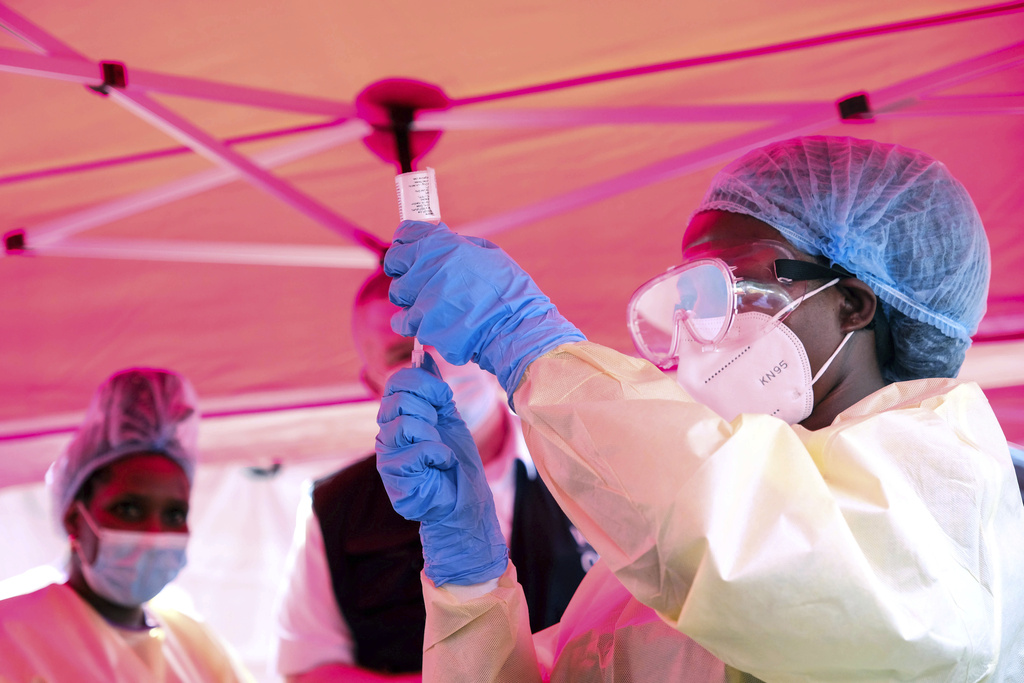 A health worker prepares to administer a vial of a vaccine against the Sudan strain of Ebola, during a trial, at Mulago Referral Hospital, in Kampala, Uganda, Feb. 3, 2025. 